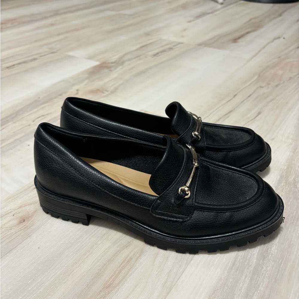 Kelly & Katie Black Leather Flats with Sleek Design